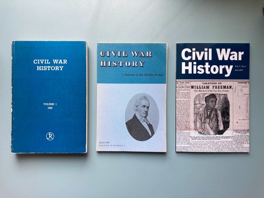 Three issues of the Civil War History journal. On the left, "Volume 1" in deep blue. In the middle, "Volume 15 Number 1" in lighter blue, the first issue published by Kent State University Press. On the right, "Volume 71 Number 2," a recent issue by Kent State University Press. 